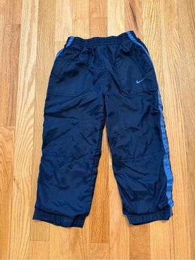 Nike Kids Navy Track Pants with Light Blue Side Stripe